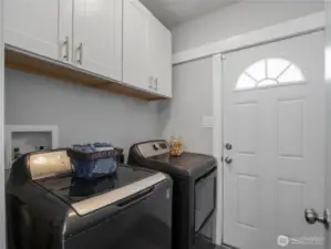 The separate laundry room has its own exit to the back yard. Washer and dryer convey with the home.