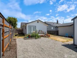 The back alley gives access to the back yard and can accommodate your car, a small RV or boat.