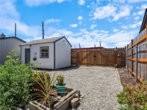 The quaint shed in the back is perfect for a craft room, office or to store your tools and toys.