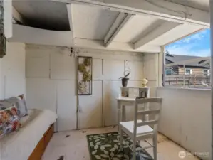 The shed is white washed on the inside and has a large window to keep it light.