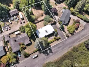 The sale also includes the vacant city lot behind it with the wood storage building. Great place to park your boat, RV or other items -  or build a workshop!