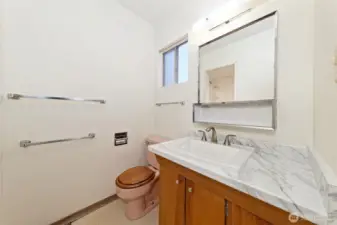 The bath off of the primary bedroom with a step-in shower.