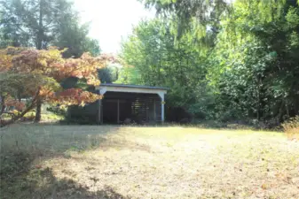 The adjacent lot in the back yard alley.