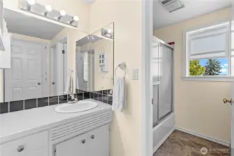 Main bathroom with separate doors to shower and toilet