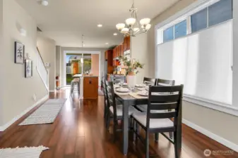 Main floor with beautiful wood floors, tons of natural light, custom window coverings, and tall ceilings.
