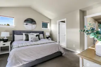 The primary suite is just that... Sweet! Sunny south and west facing windows, vaulted ceilings, large walk in closet and attached batrh.