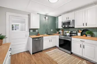 Fully remodeled kitchen with new butcher block countertops and all new cabinets.