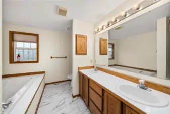Primary bath has a soaking tub and a separate shower