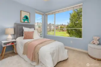 Third bedroom at end of hall, overlooking the open park space you can also see from the living room windows.