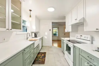 True wood cabinets with built-in pull-out cabinets.
