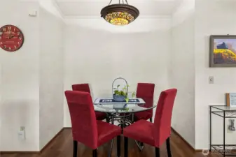 Cozy dining area is perfectly sized for intimate meals and easy entertaining.