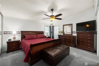 Spacious primary bedroom provides a peaceful retreat with room for comfortable furnishings and restful nights.