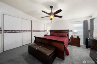 Primary bedroom includes a huge closet, plush carpet and a spacious layout, creating a comfortable and functional retreat.