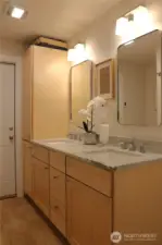 Lower bathroom with dual sinks, large linen storage, and all new everything!