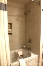 Lower bath, soaking tub with custom tile surround