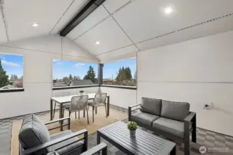 Covered rooftop deck provides year-round outdoor space.