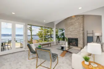 The livingroom has a floor to ceiling stne gas fireplace and a great view.