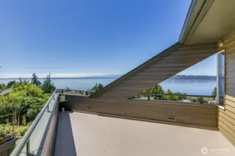 Your own private view deck off the primary bedroom. Great spot to catch some summer rays:)