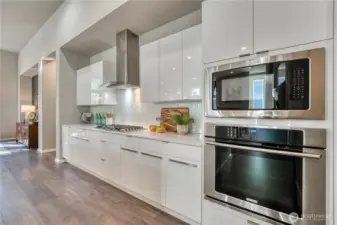 Sleek white cabinets and stainless appliances