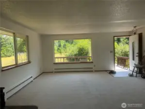 View from dining room to the front entrance and living room. Freshly painted and new carpets installed throughout (Upstairs)