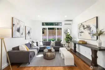 Entry level open concept living, dining, kitchen.