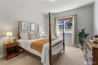 Large windows fill this bedroom with an abundance of natural light