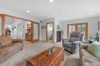 The home has a large, great room at the back of the house with French doors to block off from other parts of home on game days. The room offers large picture windows that allow plenty of natural light. The room also has a gas fireplace, built-in shelves, and a half bathroom.