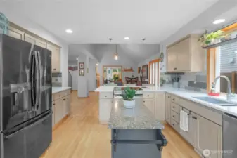 This kitchen's spacious design allows plenty of room for food preparation, plus there's no lack of storage. The large countertop makes this an excellent location for doing so. The ample natural light makes the area bright.  Hardwood floors lead out to large dining room area and all appliances included!