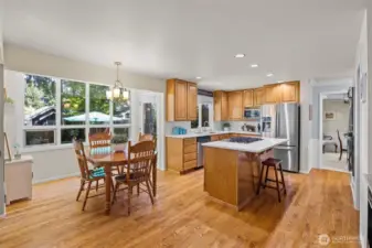 Sunroom style window over table space allows natural light to flood in. Outside in, inside out. Settling and is just right.