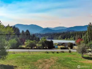 Views of the lake and Olympic Foothills from the site. Located just a short walk to the public fishing dock & boat launch for year round fishing & more !