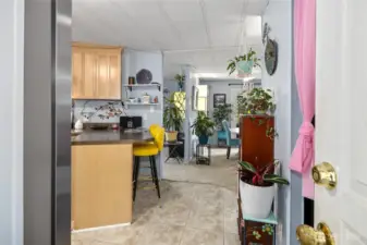 Your Home! Entry from carport back porch area. Light and Bright! New flooring and paint.