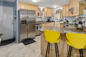 Kitchen features new floors, paint and breakfast area for more counter space and storage.