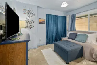 2nd Bedroom with new paint, flooring, windows and light fixture.