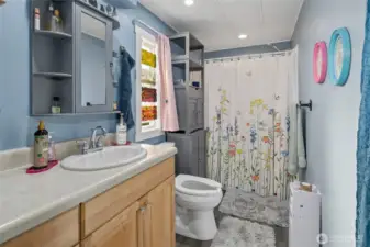 New bathroom update with paint, LVP flooring, custom built-ins and walk in shower!!!