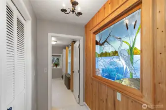 Stained glass, eclectic lighting, coffered ceilings, and knotty pine walls are sure to enchant.