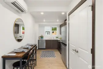Open, inviting kitchen with plenty of cabinet space plus a large pantry to keep everything neatly tucked away.