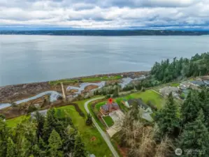 True waterfront- Property runs down the slope on a community maintained road to home's private beach / tidelands. Ability to launch kayak/smaller boats, mooring buoy option.