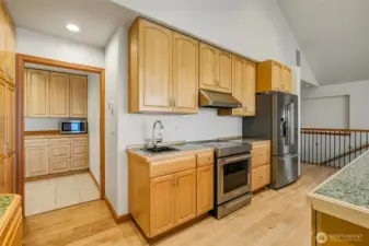 Custom cabinets, two sinks, all new Stainless-Steel appliances.