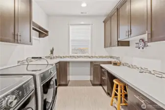 Laundry room, designated work from home space, Butlers pantry and more!  Who doesn't love a flex space with so much counter space?
