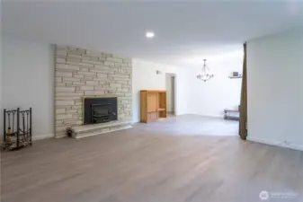 Cozy fireplace with wood flooring