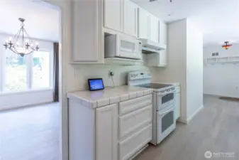 White cabinets expand this kitchens appeal