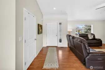 Bright open entry way & coat closet