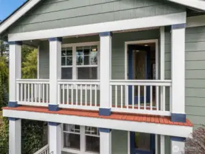 The covered balcony adds architectural interest to the front of the house - so much curb appeal.
