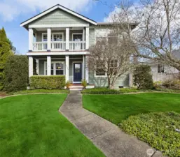 So much curb appeal with the long walk way through the pocket park to the front door.