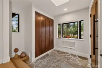 Welcoming entryway with original stone floors.