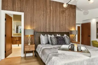 Sublime master suite wing unfolds with the subtle drama of the custom walnut acoustic feature wall.