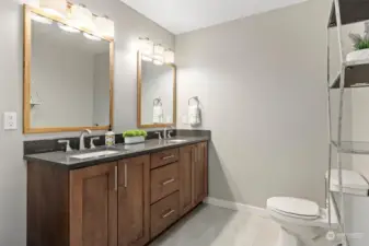 Updated primary bathroom with double vanity.