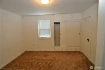 Front house bedroom has built-in closet and extra storage.