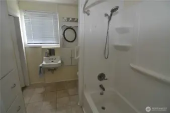 Front house bathroom is nice and large.