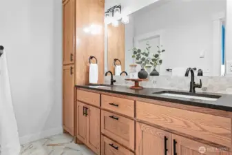 Ensuite bath has those beautiful wood cabs again, dual vanity w/undermount sinks, matte granite & linen cabinet. Walk in closet through door in mirror